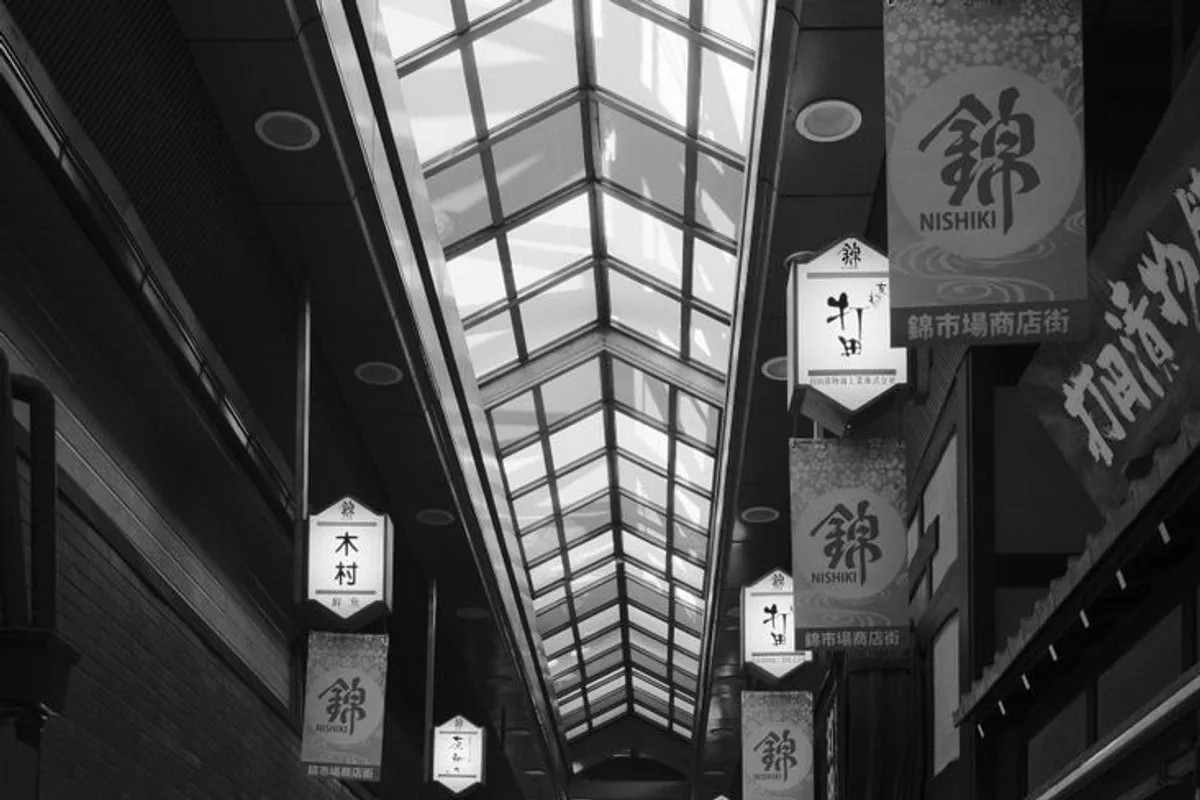 Food stalls lining the covered Nishiki Market street in Kyoto
