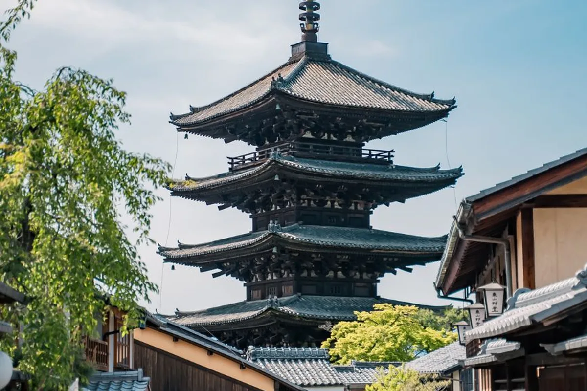 The red-lacquered Yasaka Pagoda rising above a traditional Kyoto street